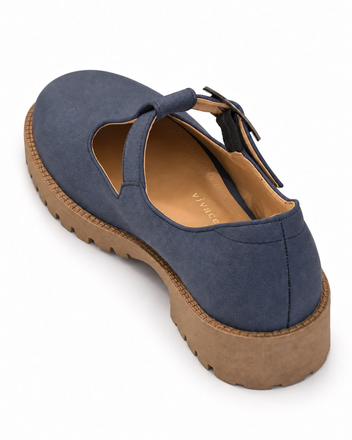 Angled view of the VIVACE Marielle navy T-bar shoe with a dark buckle, genuine leather lining and tan lug sole.