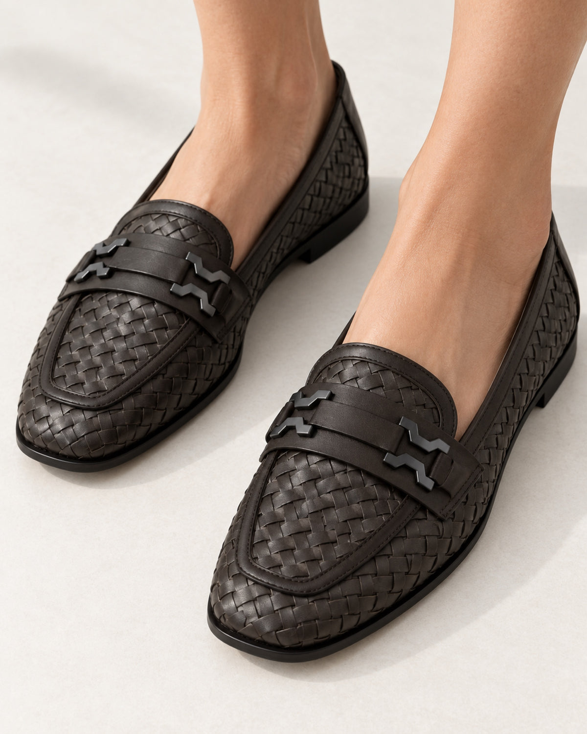 Romy Woven Loafer by VIVACE worn on feet, showing the woven texture and hardware detail.